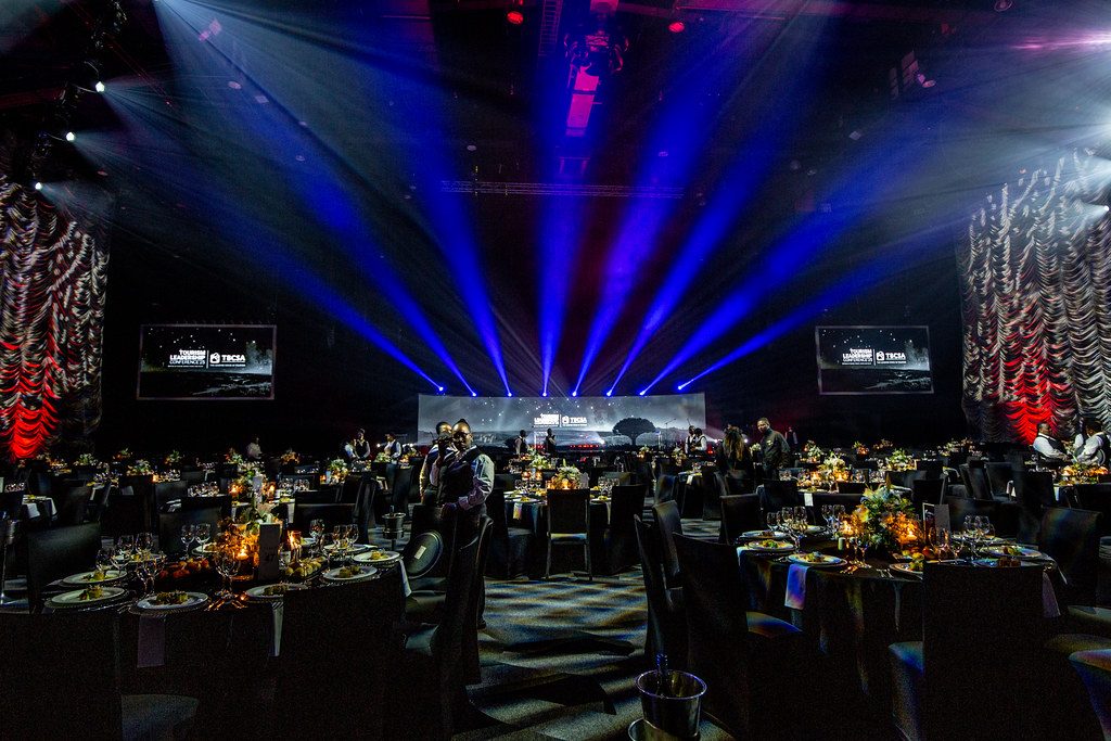 Corporate gala dinner with stage lighting