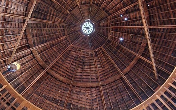 Dramatic wood-domed ceiling inside a wedding venue