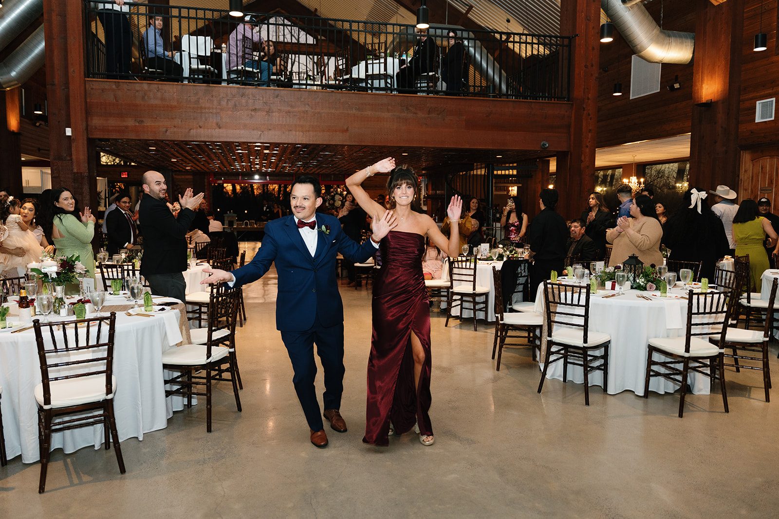 Starshine Texas reception hall with wood-beam ceiling and mezzanine